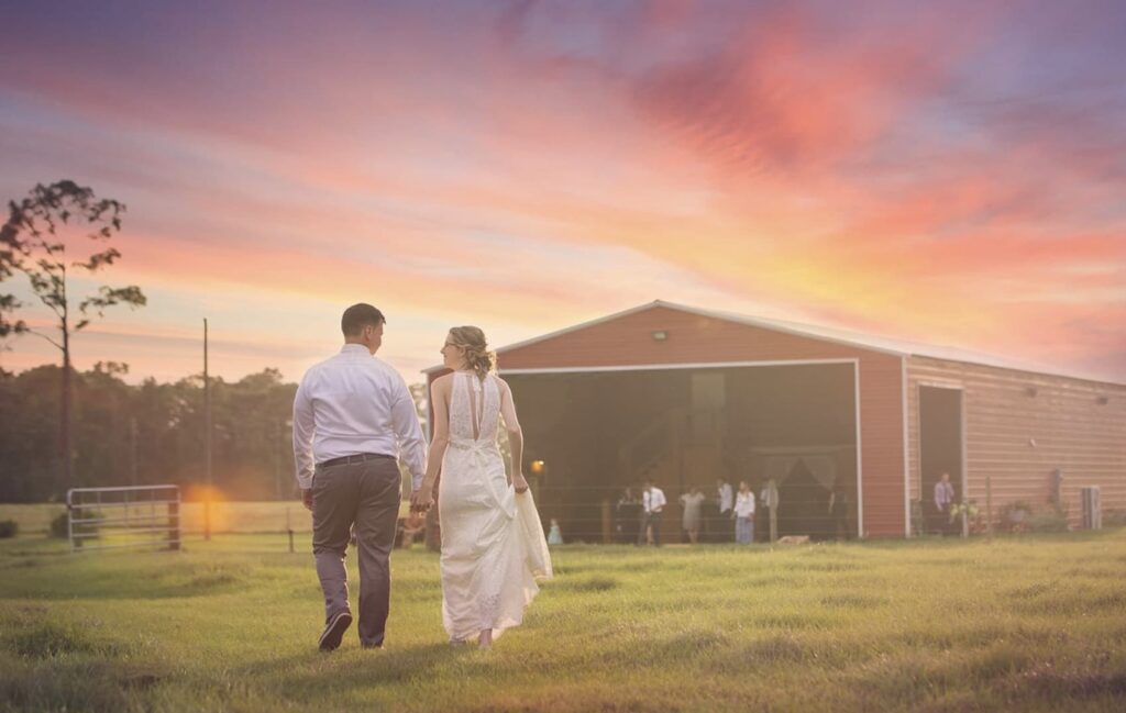 Bride and groom walking into the sunset at the Diamond L Venue in Volusia County, near Deltona, FL