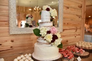 baked cake and assorted desserts in barn reception hall at the Diamond L Venue in Volusia County, near Deltona, FL