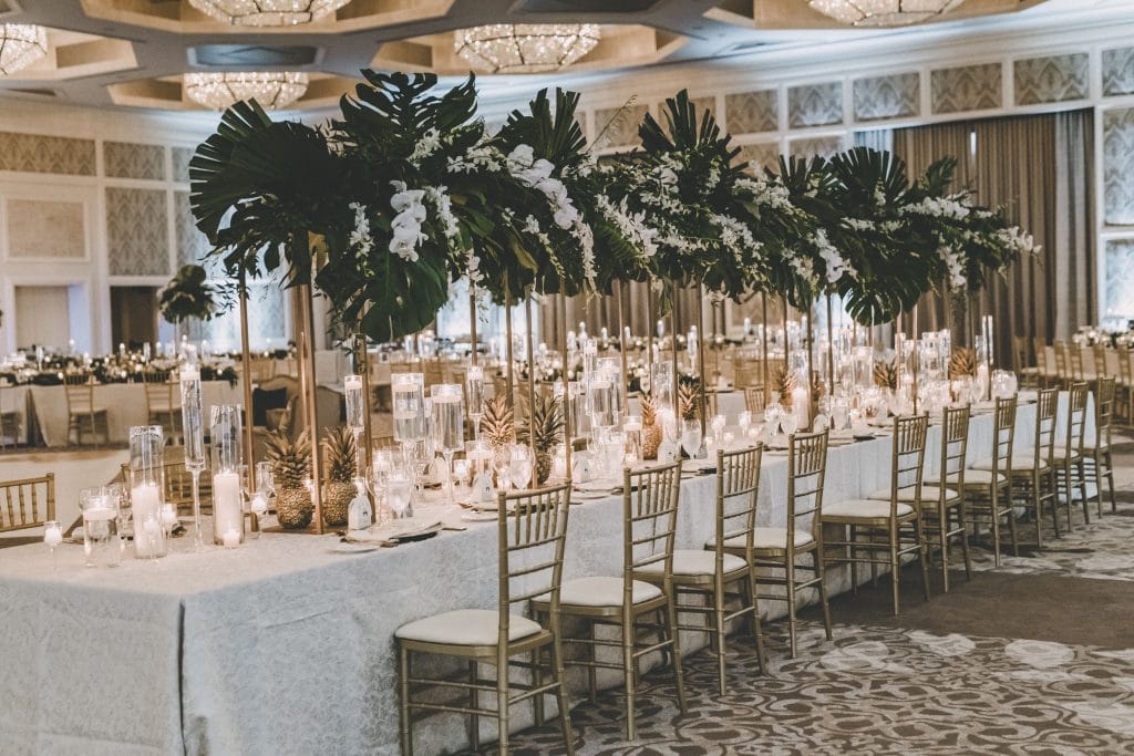 indoor reception set up, large palm centerpieces, white tablecloths, gold chairs with white white cushions, Orlando, Four Seasons Orlando at Walt Disney World Resort