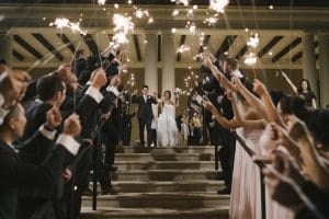 the happy couple leaving their reception with guests greeting them with sparklers, Orlando, Four Seasons Orlando at Walt Disney World Resort