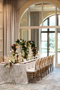 Four-Seasons-at-Walt-Disney-World-Long table with floral arches as centerpieces
