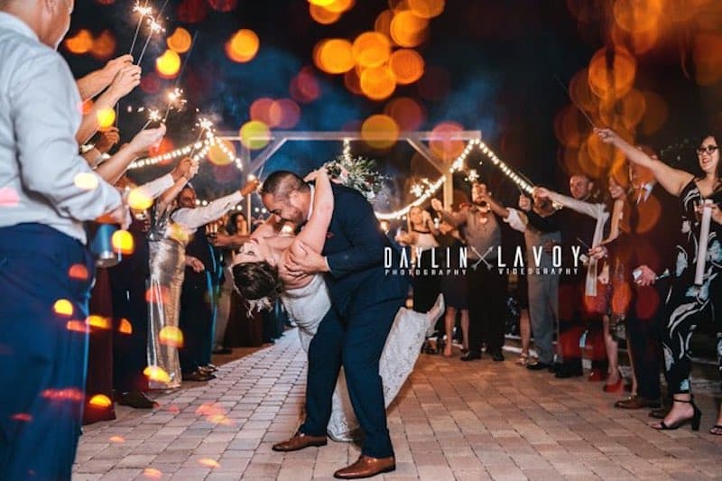 Hidden Barn bride and groom kissing during sparkler exit