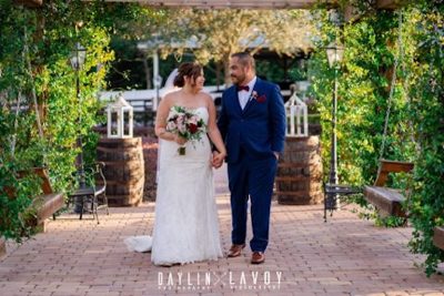 Hidden Barn bride and groom walking outside holding hands
