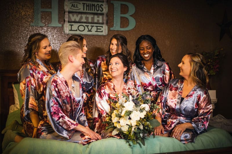 Hidden Barn bride surrounded by all of her bridesmaids