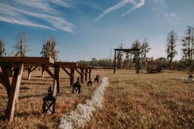 outdoor wedding ceremony with wooden benches clermont florida farm