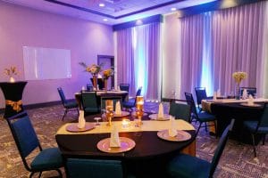 Reception set up, purple uplighting, dance floor, Hampton Inn & Suites Gateway Village