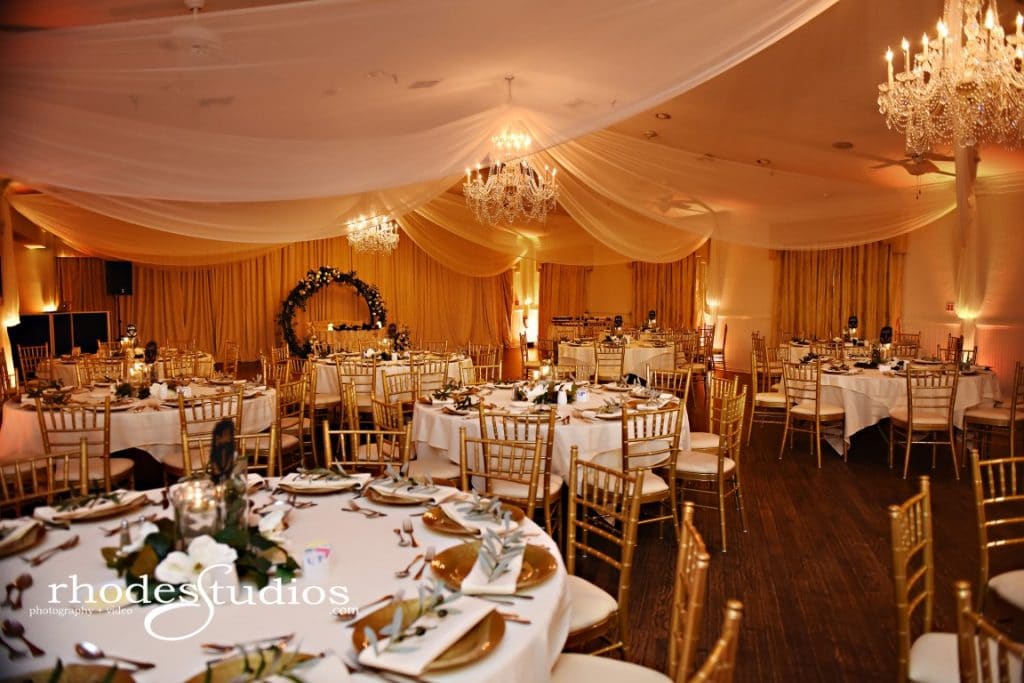 The-Highland-Manor-Round reception tables with place settings and small floral centerpieces