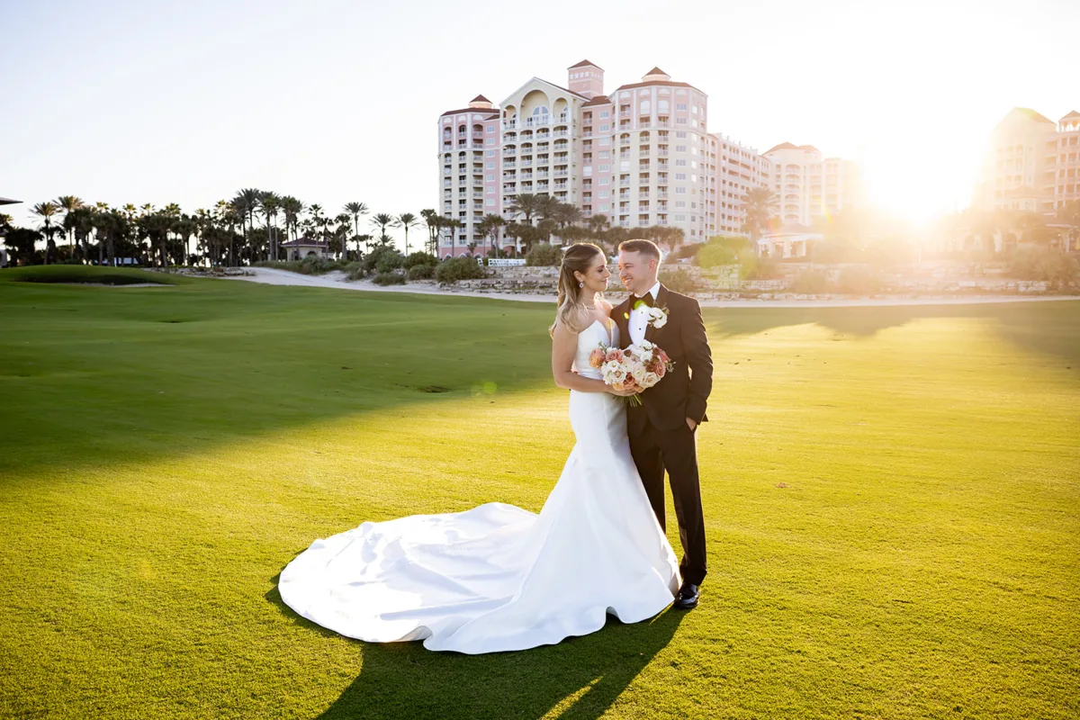 hammock beach resort 9110c6c4 - Hammock Beach Golf Resort & Spa Bride and groom on spacious lawn in front of Hammock Beach
