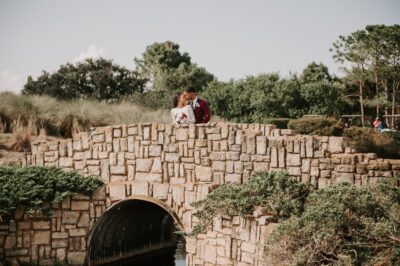 wedding couple standing on a bride made of stone, Orlando, FL