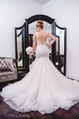 bride standing in front of the mirror in her wedding dress, Orlando, FL