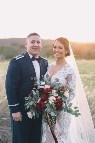Military dress groom and bride in field