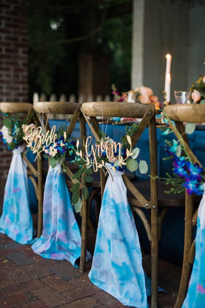 Bluegrass Chic table setting with chairs in blue