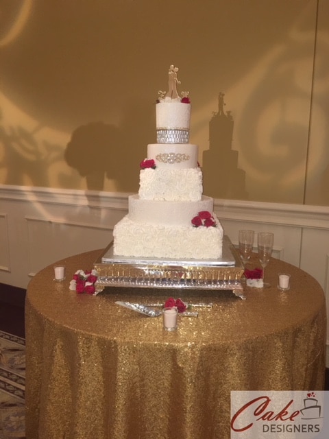 Cake Designers - 5-tier wedding cake on glittery gold table