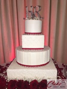 Cake Designers - clean, modern cake surrounded by red roses