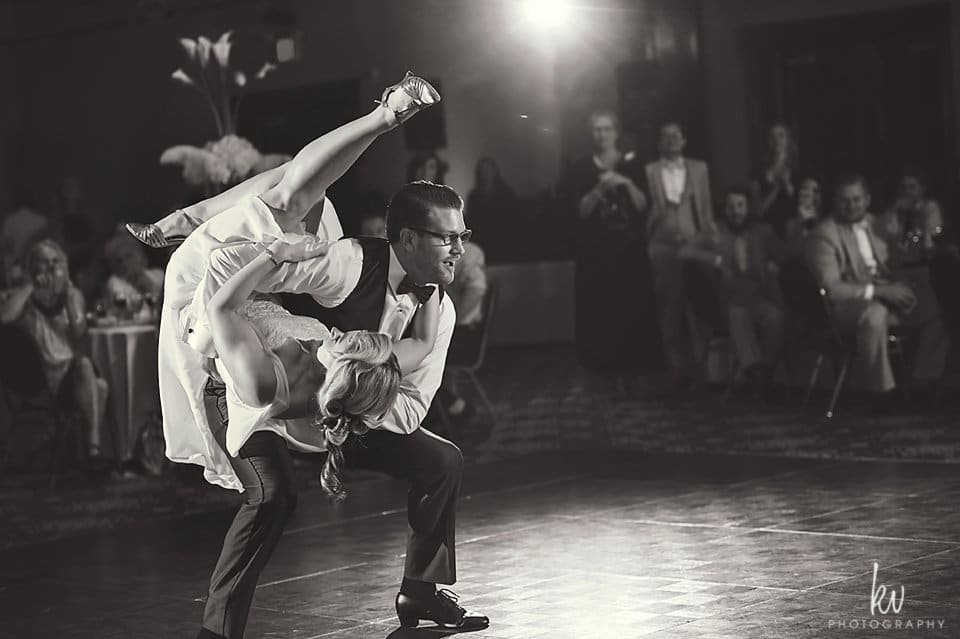 Our DJ Rocks - action shot of bride and groom swing dancing