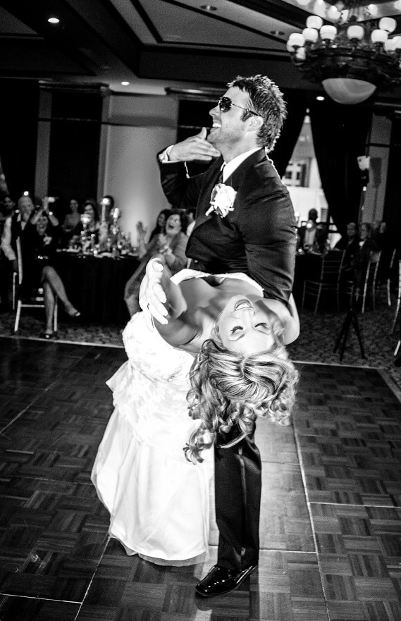 Our DJ Rocks - groom dipping bride on dance floor
