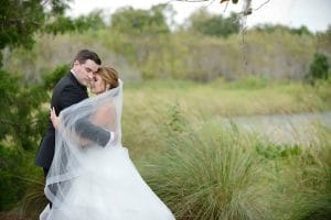 bride and groom hugging outdoors, field, Orlando, FL