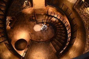 aerial shot of bride and groom at bottom of spiral stairs, Orlando, FL