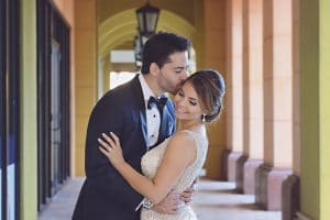 groom kissing bride on cheek, wedding day, Rhodes Studios, Orlando, FL