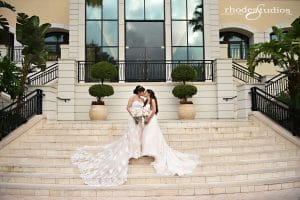 Rhodes Studios, photography and video, brides kissing on stone staircase, Orlando, FL