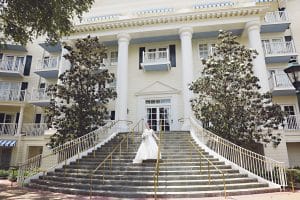 Rhodes Studios, photography and video, bride on steps of Colonial building, Orlando, FL