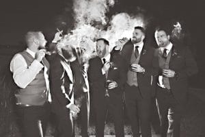 groom and groomsmen laughing and smoking cigars, black and white photos, Rhodes Studios, Orlando, FL