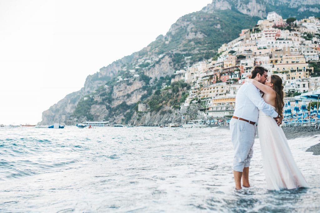 Rudy & Marta Photography - bride and groom kissing on European beach