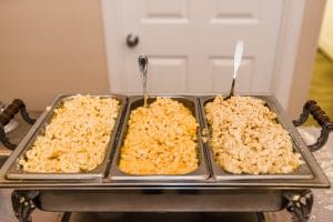 Two Chicks and a Pot - Three chafing dishes filled with macaroni and cheese
