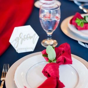 Blue View Event Barn - place setting with bold colors and greenery