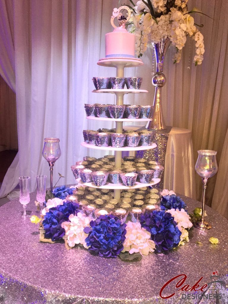 multi layered tower with individual cake servings in blue and white
