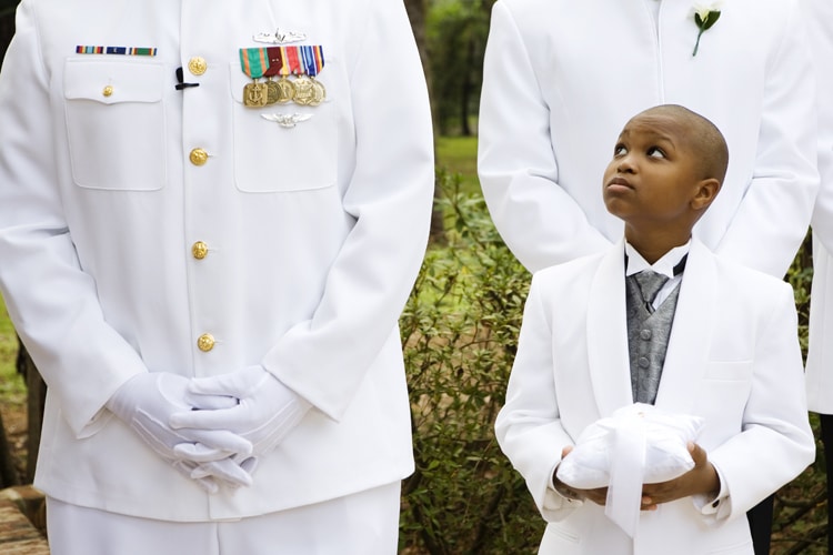 Lori Barbely Photography - ring bearer looking up at man in navy uniform