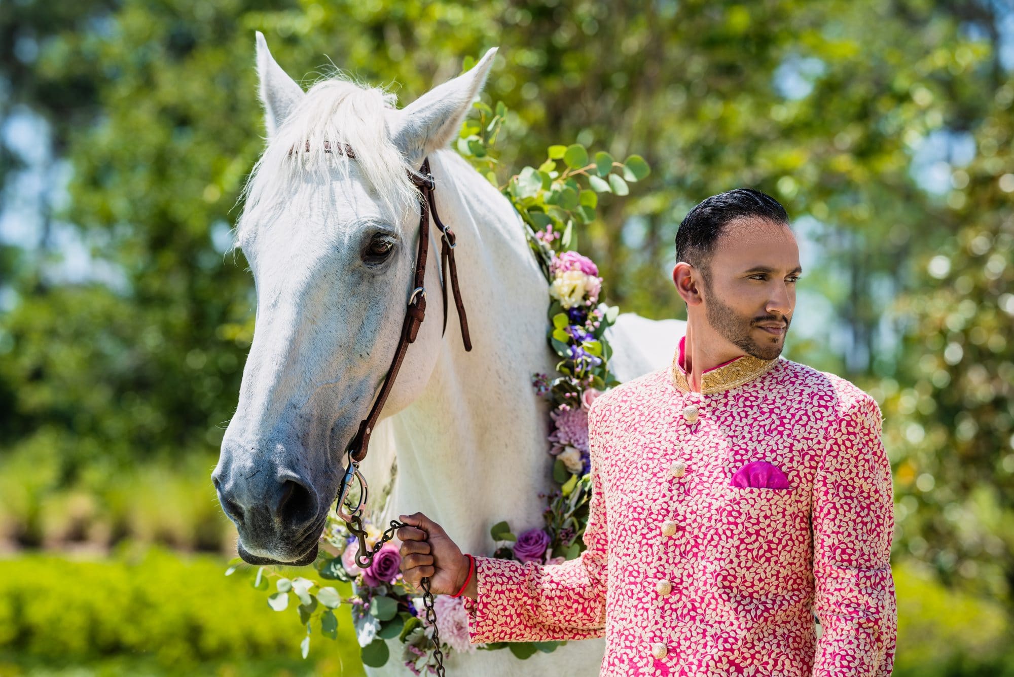 Indian groom with white horse