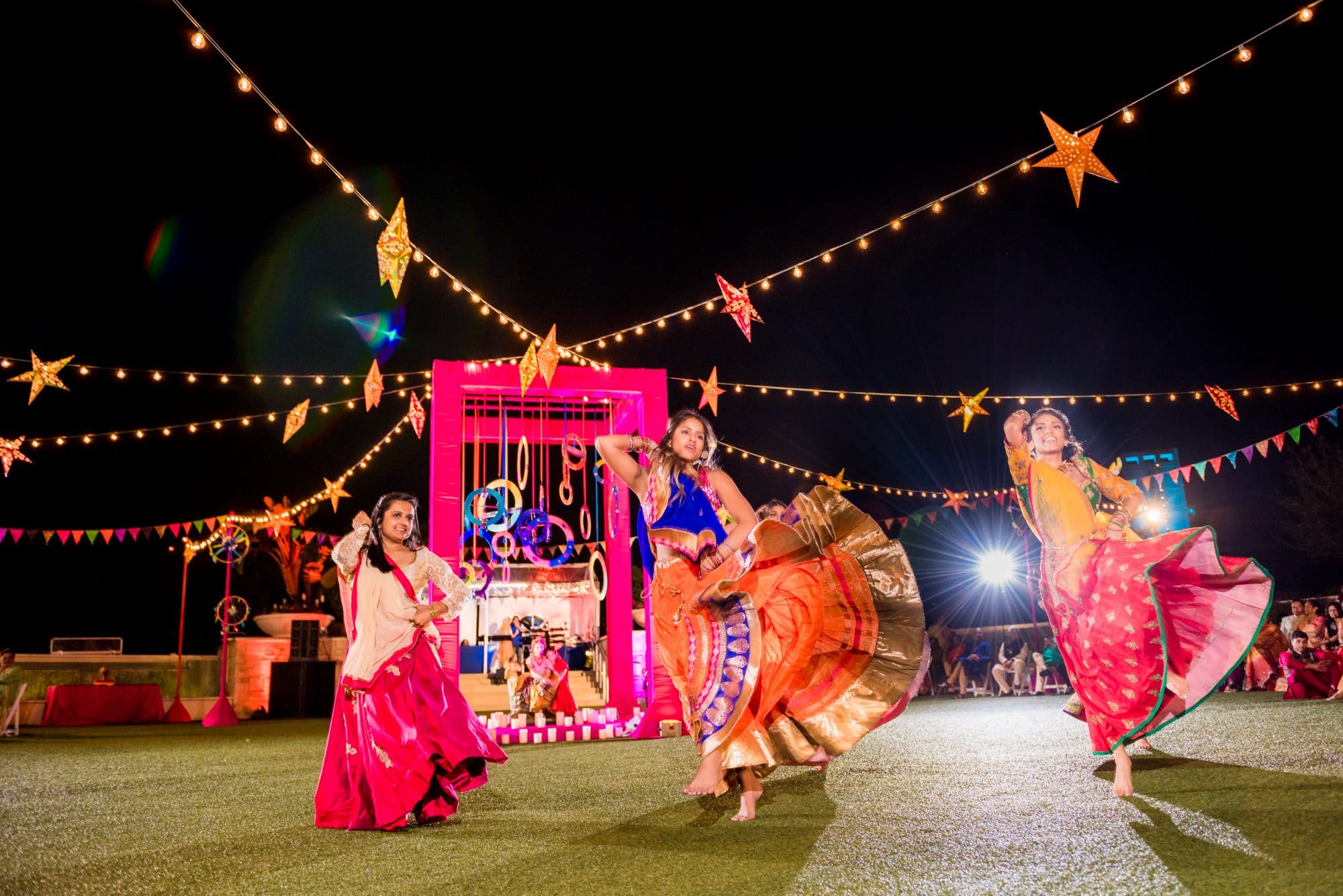 Indian women performing dance at wedding ceremony