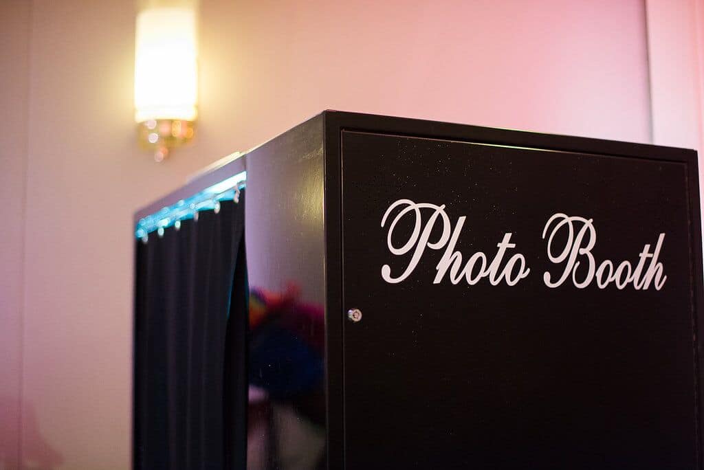 Black classic photo booth with "photo booth" text on the side