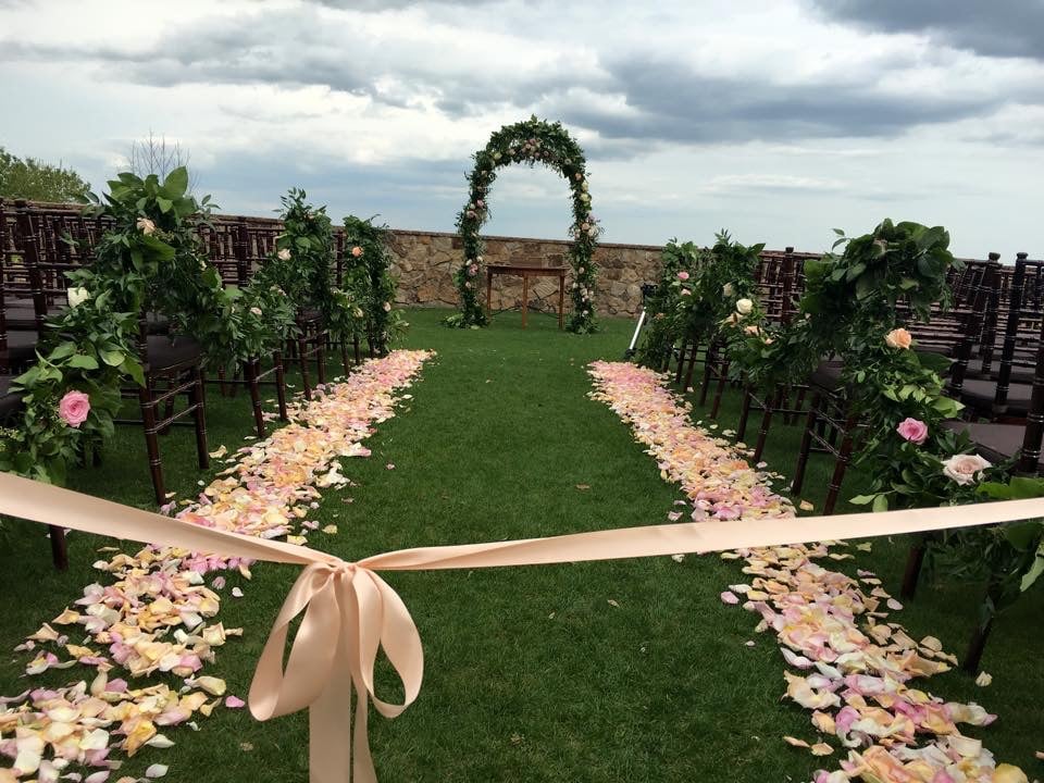 Atmospheres Floral - ceremony aisle lined with peach rose petals and cordoned off with peach ribbon