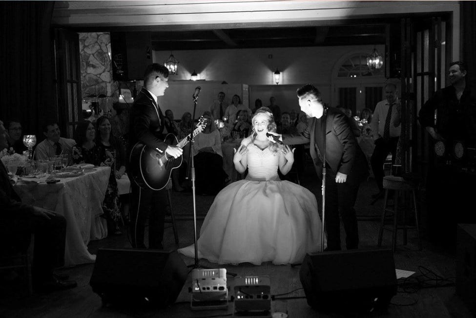 Singers Dan and Shay serenading bride at reception