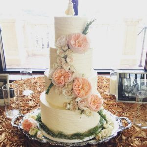 Everything Cake - white cake with cascade of pink peonies and rosemary around the base