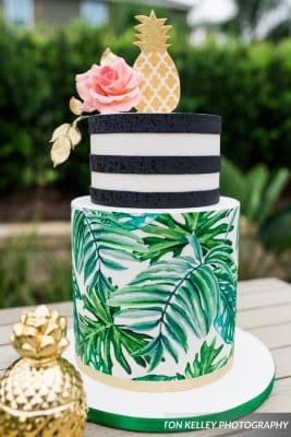 Everything Cake - small cake with palm fronds printed on bottom tier and black stripes on top tier