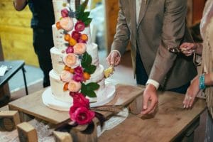Everything Cake - semi naked cake with beautiful blooms cascading down