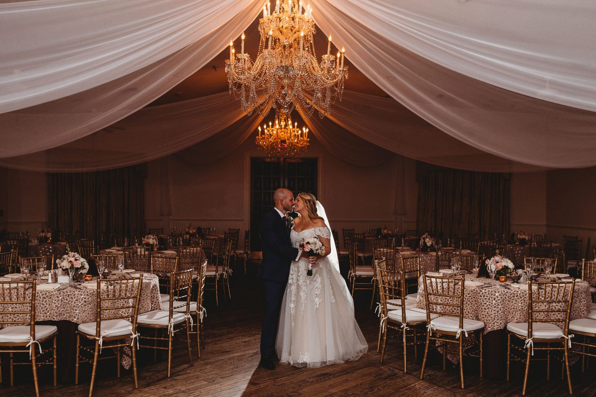 Rachel Doyle Photography - bride and groom in empty reception hall