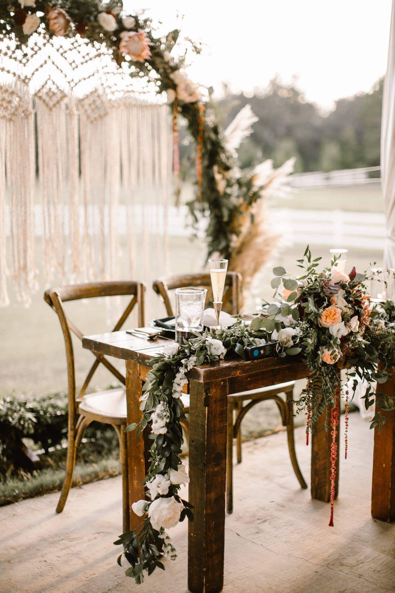 Bramble Tree Estate - rustic sweetheart table and floral arch