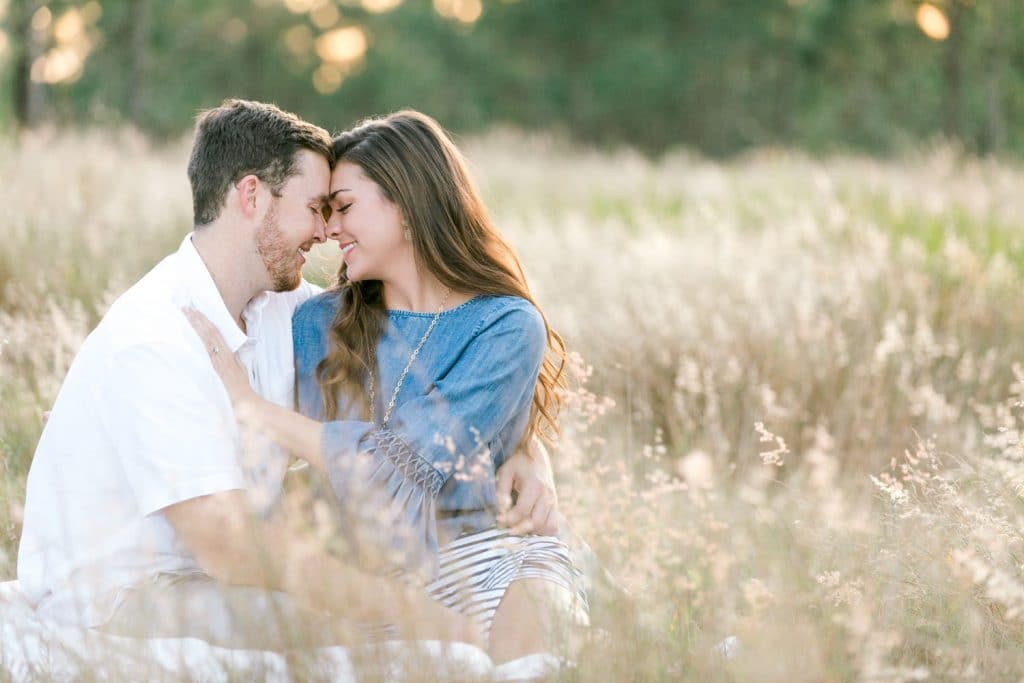 engagement photo shoot in field by Bumby Photography