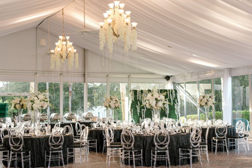 Bumby Photography - Your photographer should capture every detail of your wedding day, like this reception tent draped in white with chandeliers