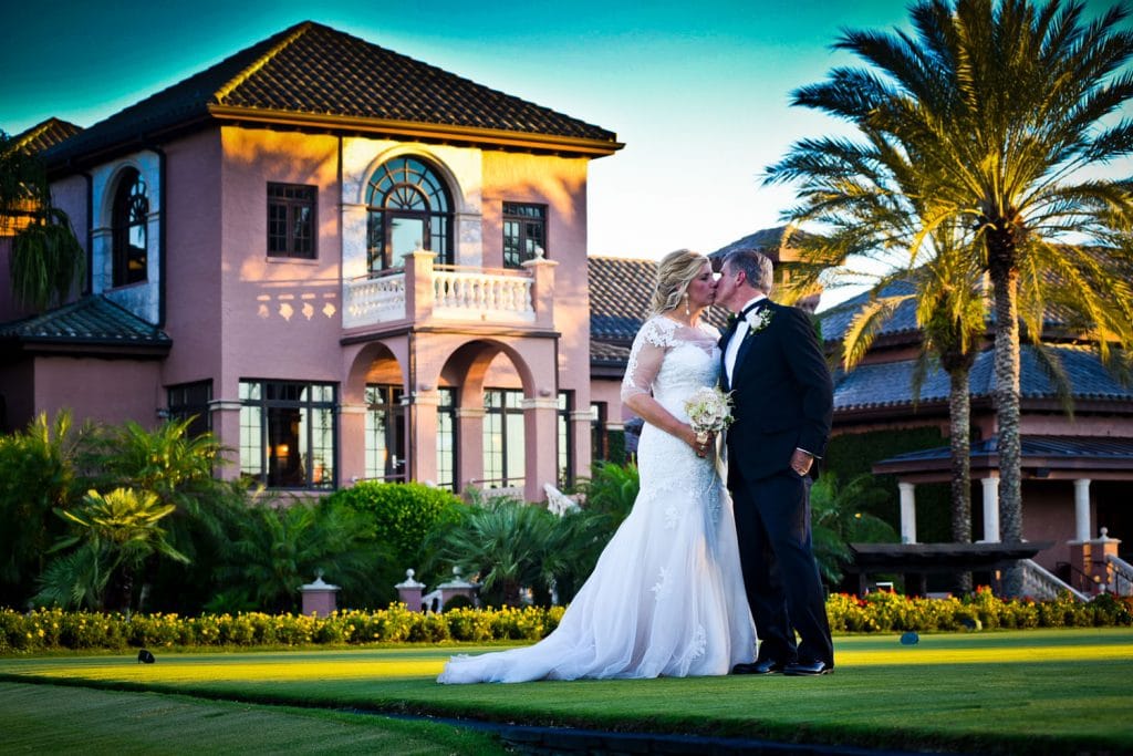 Chris Gillyard Photography - bride and groom in front of historic Spanish-inspired mansion