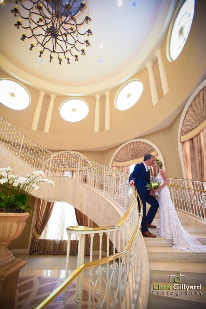 Chris Gillyard Photography - bride and groom on gorgeous sweeping staircase