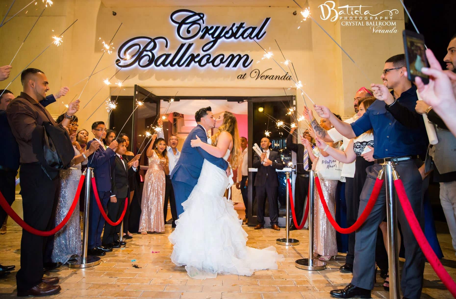 Crystal Ballroom at Veranda - newlyweds kissing during sparkler send off