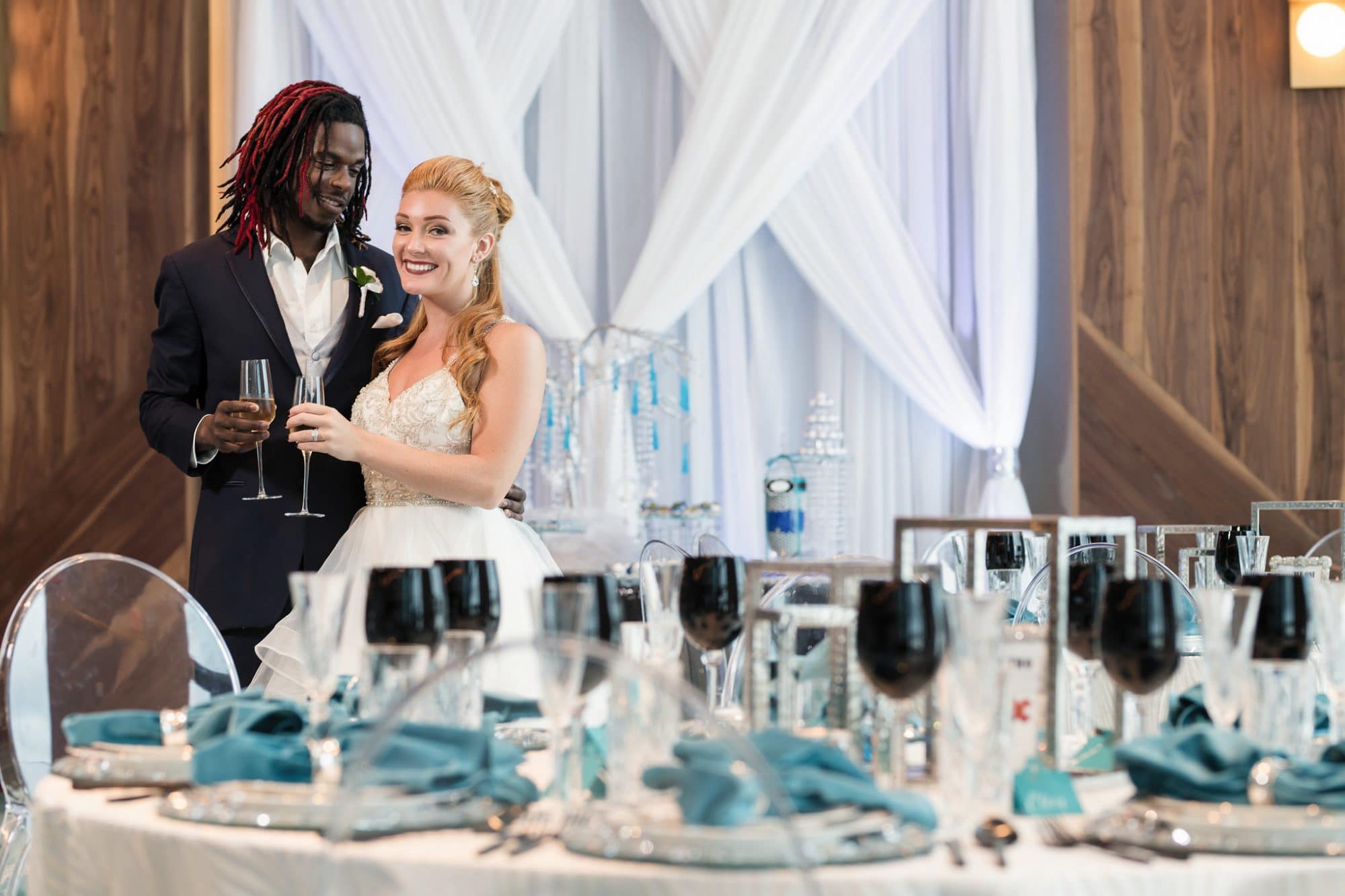 Hard Rock Hotel Daytona Beach - bride and groom toasting each other in empty reception hall