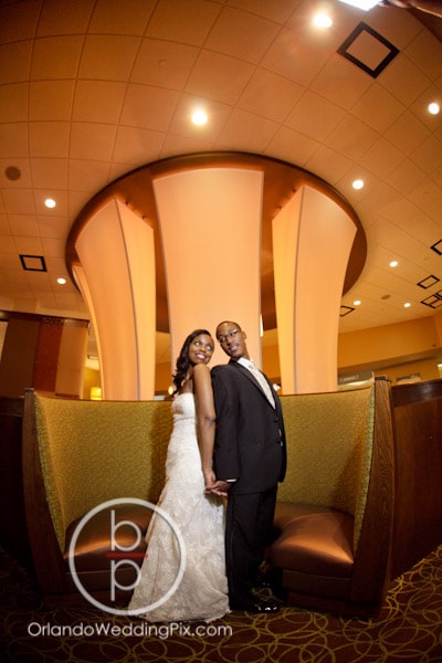 Hilton Altamonte Springs - couple posing in semi-circular booth