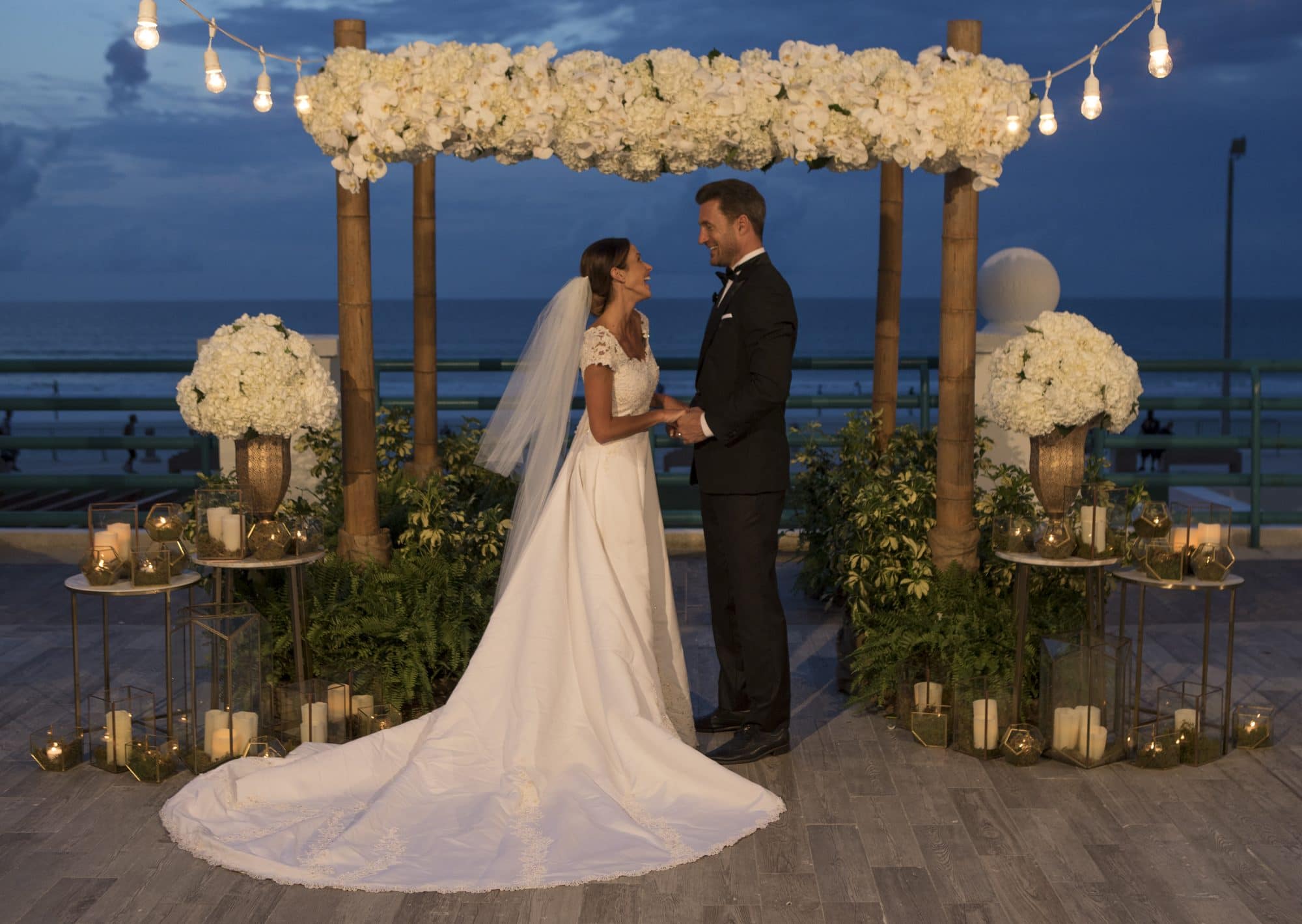 Hilton Daytona Oceanfront Resort - bride and groom on patio overlooking the ocean