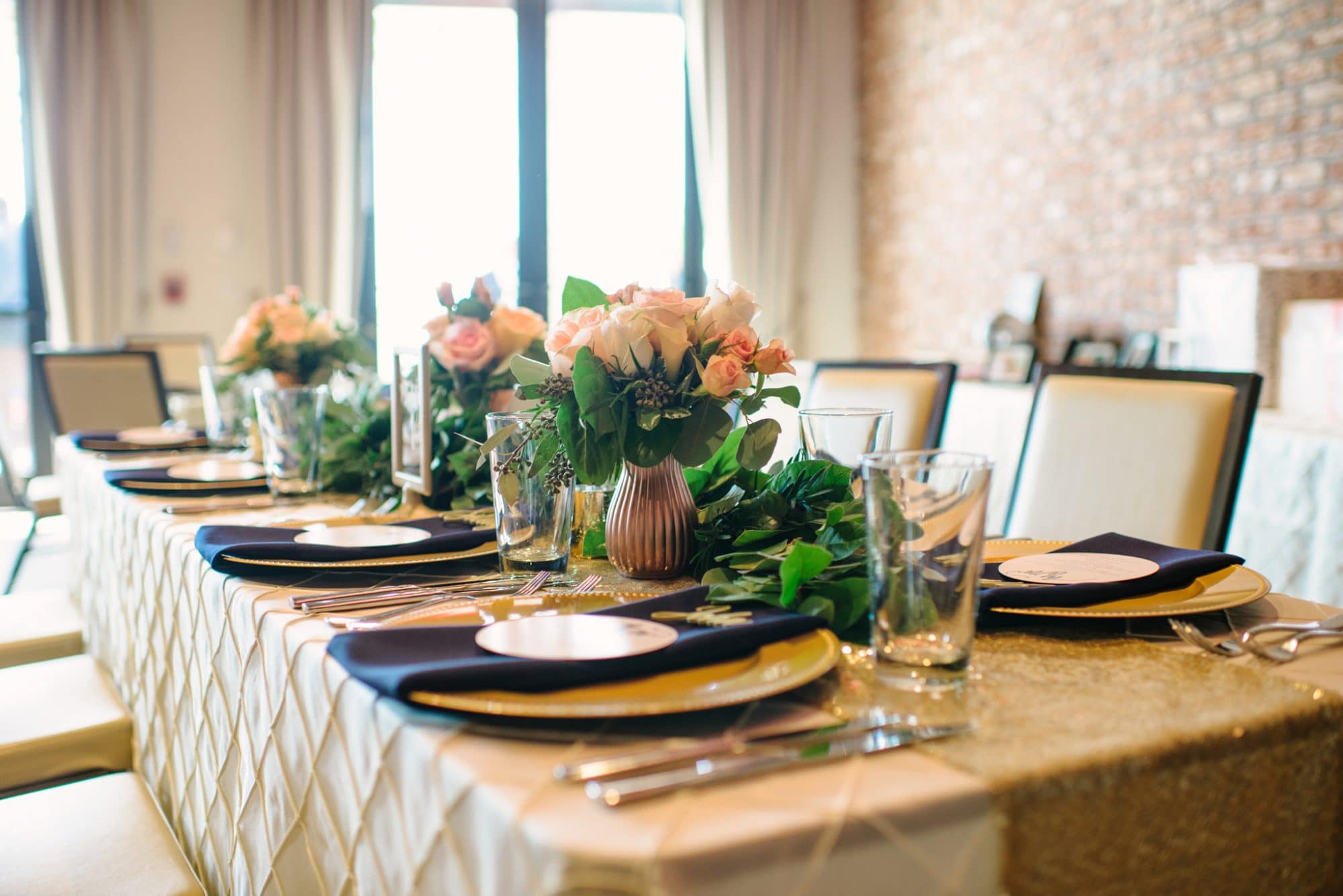 Lakehouse Lake Nona - lovely tablescape with gold tablecloth and gold vases